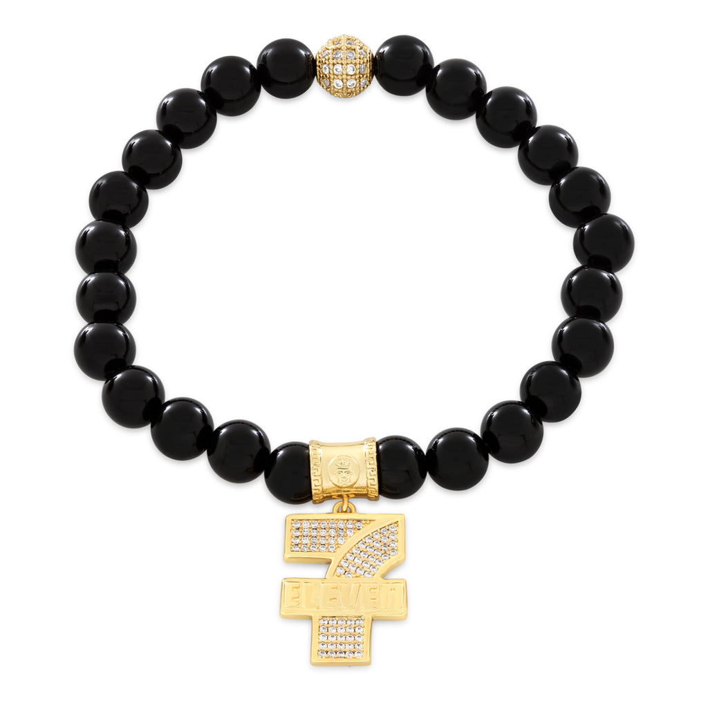 Black beaded bracelet with gold 7-Eleven logo pendant