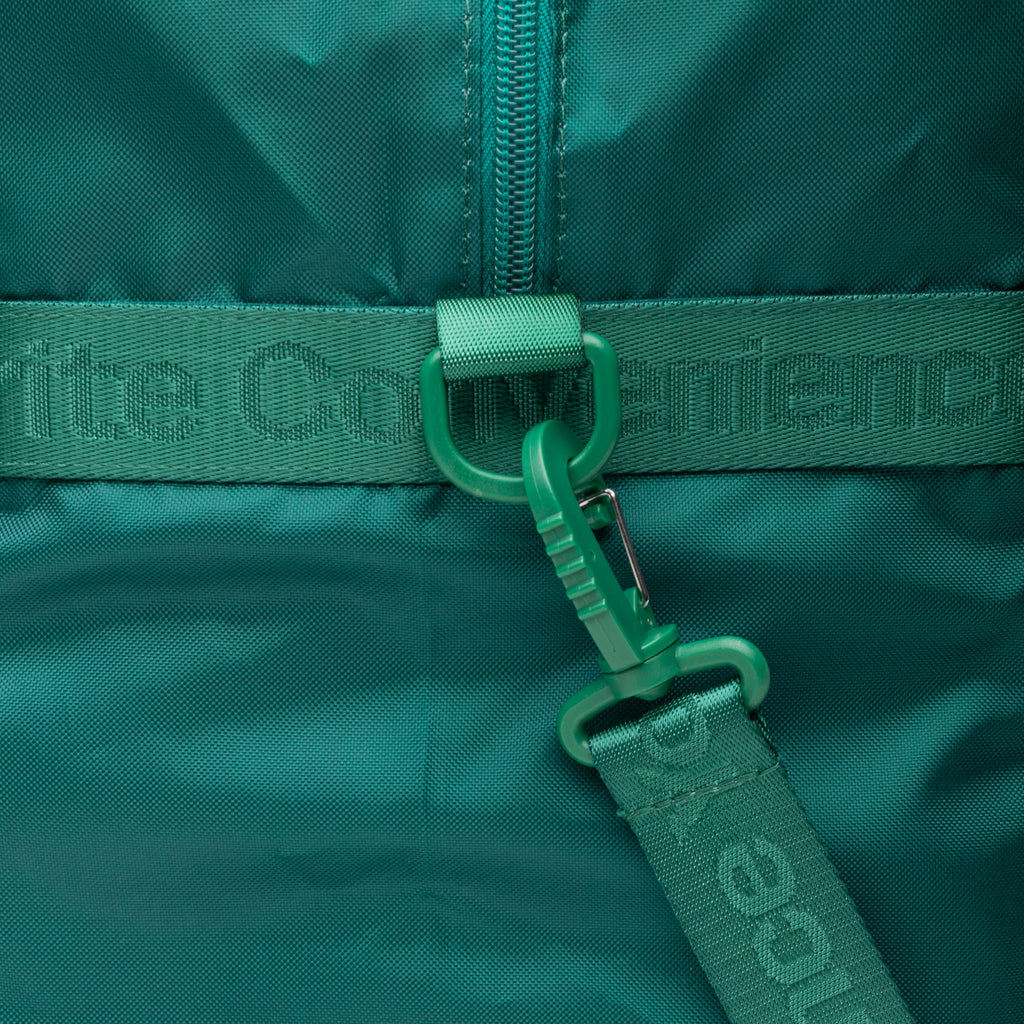 Green duffle bag with detailing that reads "Your Favorite Convenience" 