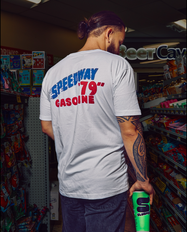 Man in a Speedway store wearing Speedway merch