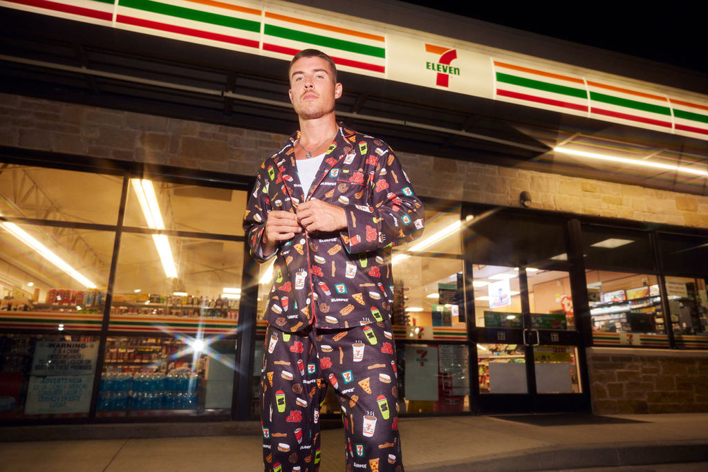 Man wearing 7-Eleven snack print pajama set
